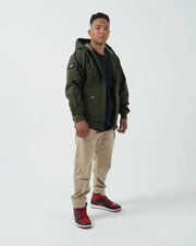 Kingz Canvas Jacket Military Green - Full Body Front View Male Athlete Hooded Design Black Chest Patch Left Sleeve Crown Badge Streetwear [color:Black]