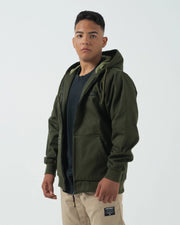 Kingz Canvas Jacket Military Green - Front View Male Model Hooded Design KINGZ Chest Logo Full Zip Closure Streetwear Casual Apparel [color:Military Green]