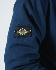 Kingz Canvas Jacket Navy Blue - Close-Up Detail View Sleeve Black Patch Yellow Text Crown Badge Premium Crafted Gear Streetwear [color:Navy Blue]