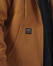 Kingz Canvas Jacket Desert - Close-Up Detail View Chest Pocket Kingz Logo Patch Black Inner Lining Tan Drawstring Casual Streetwear Urban Style [color:Desert]