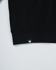 Kingz Jiu Jitsu Culture Hoodie - Hem Detail Close Up - Kingz Crown Woven Hem Label - Black - Men's BJJ Hoodie