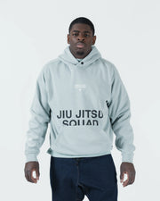 Sea foam green BJJ hoodie front view on adult male model showing Jiu Jitsu Squad print and kangaroo pocket
