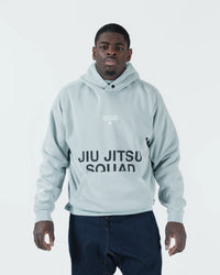 Sea foam green BJJ hoodie front view on adult male model showing Jiu Jitsu Squad print and kangaroo pocket