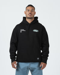 Kingz JJ Dept Hoodie - Front Worn View - Jiu Jitsu Department Oval Chest Logo - Black - BJJ Streetwear Hoodie