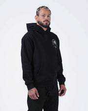 Black BJJ hoodie cropped front view on adult male model with rose chest graphic and heavyweight fleece