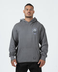 Grey BJJ hoodie front view on adult male model showing Pursue The Gentle Art rose chest graphic