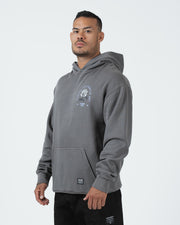 Grey BJJ hoodie front three-quarter view on adult male model highlighting rose graphic and heavyweight fit