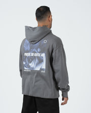 Grey BJJ hoodie rear side profile on adult male model showing angled Pursue The Gentle Art back print
