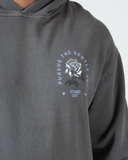 Grey BJJ hoodie chest closeup of Pursue The Gentle Art circular rose emblem and Stand Out screen print