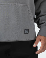 Grey BJJ hoodie bottom hem closeup showing woven Kingz premium crafted gear label tag and ribbed hem