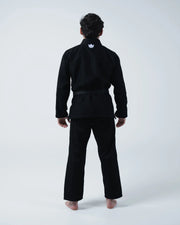 Kingz Kore V2 BJJ Gi Black - Full Back View Male Athlete Standing Wearing Black Kimono White Crown Logo Back Collar Barefoot