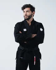 Kingz Kore V2 BJJ Gi Black - Side Angle View Male Athlete Wearing Black Complete Gi Set Jacket Pants Black Belt Barefoot