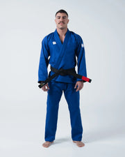 Kingz Kore V2 BJJ Gi Blue - Full Body Front View Male Athlete Complete Blue Gi Set Jacket and Pants Black Belt Barefoot