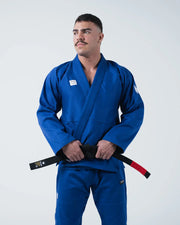 Kingz Kore V2 BJJ Gi Blue - 3/4 Body Front View Second Male Athlete Wearing Blue Kimono Black Belt Hands Clasped