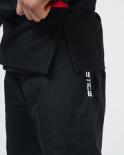 Kingz Balistico 4.0 BJJ Gi Black lower body closeup showing Balistico logo print on ripstop pants
