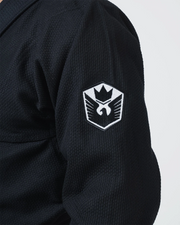 Kingz Balistico 4.0 BJJ Gi Black shoulder closeup showing embroidered crest patch on pearl weave