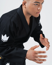 Kingz Balistico 4.0 BJJ Gi Black worn by male athlete in competition ready guard stance on mat