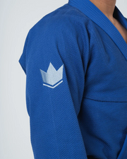 Kingz Balistico 4.0 BJJ Gi Blue shoulder closeup showing white crown logo patch on pearl weave sleeve