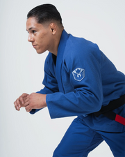 Kingz Balistico 4.0 BJJ Gi Blue side profile of male athlete in competition ready fighting stance