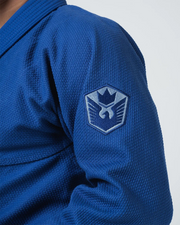 Kingz Balistico 4.0 BJJ Gi Blue upper arm closeup showing detailed embroidered crown shield crest patch