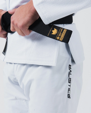 Kingz Balistico 4.0 BJJ Gi White waist detail showing hand on gold label black belt and Balistico pant print