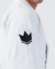 Kingz Balistico 4.0 BJJ Gi White shoulder seam closeup showing black crown logo and pearl weave texture