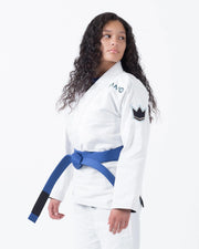 Kingz Nano 3.0 Women's BJJ Gi White - 3/4 Angled Upper Body View Female Athlete Blue Belt NANO Text Crown Logo Women's Cut