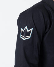 Kingz Nano 3.0 BJJ Gi Black sleeve closeup showing embroidered crown logo patch on lightweight weave