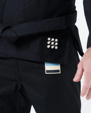 Kingz Nano 3.0 BJJ Gi Black skirt closeup showing dotted Nano logo embroidery and striped woven label