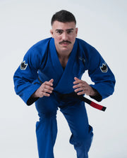 Kingz Nano 3.0 BJJ Gi Blue front competition stance showing male athlete crouched with crown patches