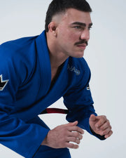 Kingz Nano 3.0 BJJ Gi Blue upper body action shot of male athlete in guard stance with Nano logo