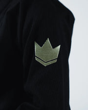 Kingz The ONE V2 Women's Jiu Jitsu Gi Black - Close-Up Detail View Embroidered Gold Crown Badge Textured Black Fabric Sleeve BJJ Gi [color:Black]