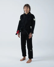 Kingz The ONE V2 Women's Jiu Jitsu Gi Black - Full Body Front View Female Athlete Black Gi Crown Logo Shoulders Red Belt Tip Embroidered Logo Pants BJJ Training Gi [color:Black]