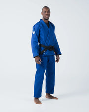 Kingz The ONE V2 BJJ Gi Blue angled full body stance showing gi jacket pants and crown shoulder patch