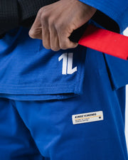 Kingz The ONE V2 BJJ Gi Blue skirt closeup showing number one logo red belt tail and premium label