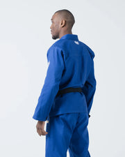 Kingz The ONE V2 BJJ Gi Blue side profile view showing gi jacket pants black belt and crown logo