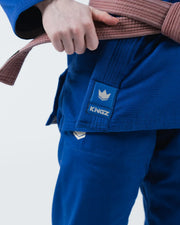 Kingz The ONE V2 Women's Jiu Jitsu Gi Blue - Close-Up Detail View Hand Tying Belt Blue Fabric KINGZ Logo Patch Left Waist Reinforced Stitching Durable Design BJJ Gi Training [color:Blue]