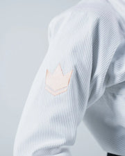 Kingz The ONE V2 Women's Jiu Jitsu Gi White - Close-Up Detail View Sleeve Crown Badge Embroidered Peach Stitching Textured Fabric Women's BJJ Gi Training Apparel [color:White]