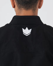 Kingz The ONE V2 BJJ Gi Black upper back closeup showing white crown logo below rubber collar