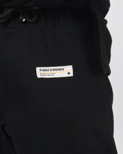Kingz The ONE V2 BJJ Gi Black pants waistband closeup showing drawstring loops and premium crafted label