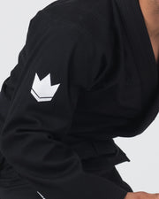 Kingz The ONE V2 BJJ Gi Black sleeve closeup showing white crown logo patch on pearl weave fabric