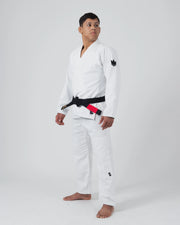 Kingz The ONE V2 BJJ Gi White three-quarter full body angle showing gi fit and number one leg logo