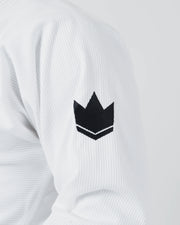 Kingz The ONE V2 BJJ Gi White upper arm detail showing embroidered black crown patch and weave texture