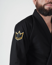 Kingz Nano 3.0 Terra LE BJJ Gi Black sleeve closeup showing gold outlined crown logo patch