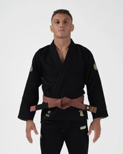 Kingz The ONE V2 LE BJJ Gi Black Green front view showing brown belt and green accent crown logos