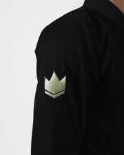 Kingz The ONE V2 LE BJJ Gi Black Green sleeve closeup showing green crown logo patch on pearl weave