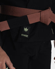 Kingz The ONE V2 LE BJJ Gi Black Green waist closeup showing brown belt and green crown Kingz logo