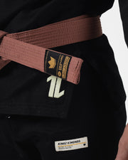 Kingz The ONE V2 LE BJJ Gi Black Green skirt closeup showing gold label brown belt and green one logo