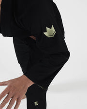 Kingz The ONE V2 LE BJJ Gi Black Green arm detail showing green crown sleeve patch and pant one logo