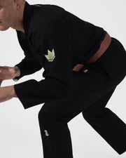 Kingz The ONE V2 LE BJJ Gi Black Green side profile of male athlete in competition ready stance